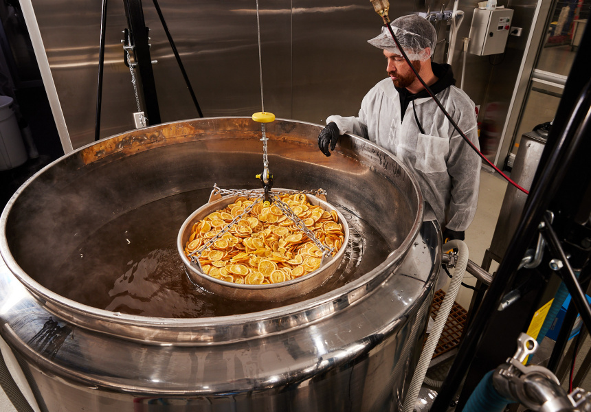 The oranges are steeped for four hours at 65 degrees Celcius in a 1500-litre “stockpot on steroids”. Dehydrated oranges have a more complex flavour than regular oranges or juice. 
