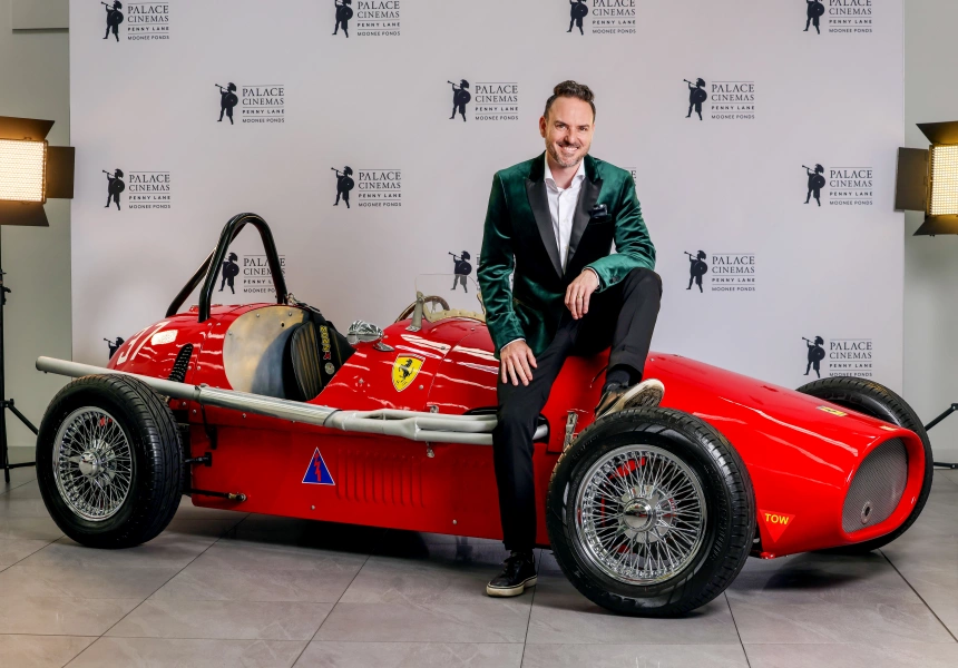 CEO Ben Zeccola and one of the vintage Ferraris loaned for the opening of Penny Lane.
