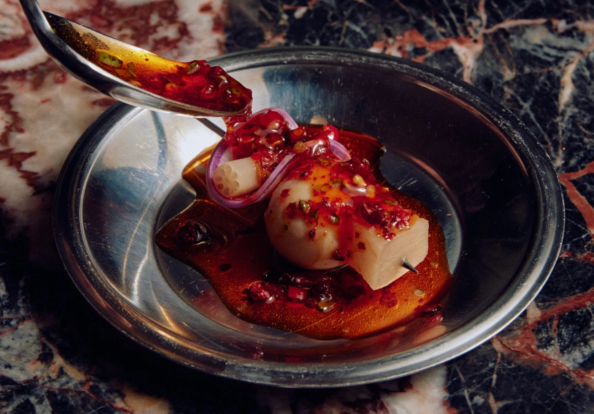 Tea quail egg skewer, pickled lotus root and Sichuan chilli oil
