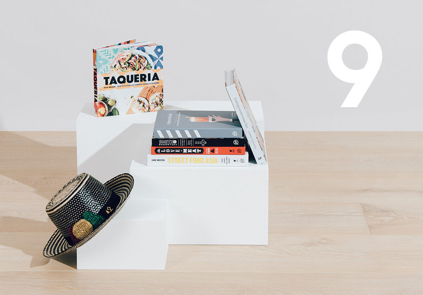 A handwoven hat and bundle of cookbooks.
