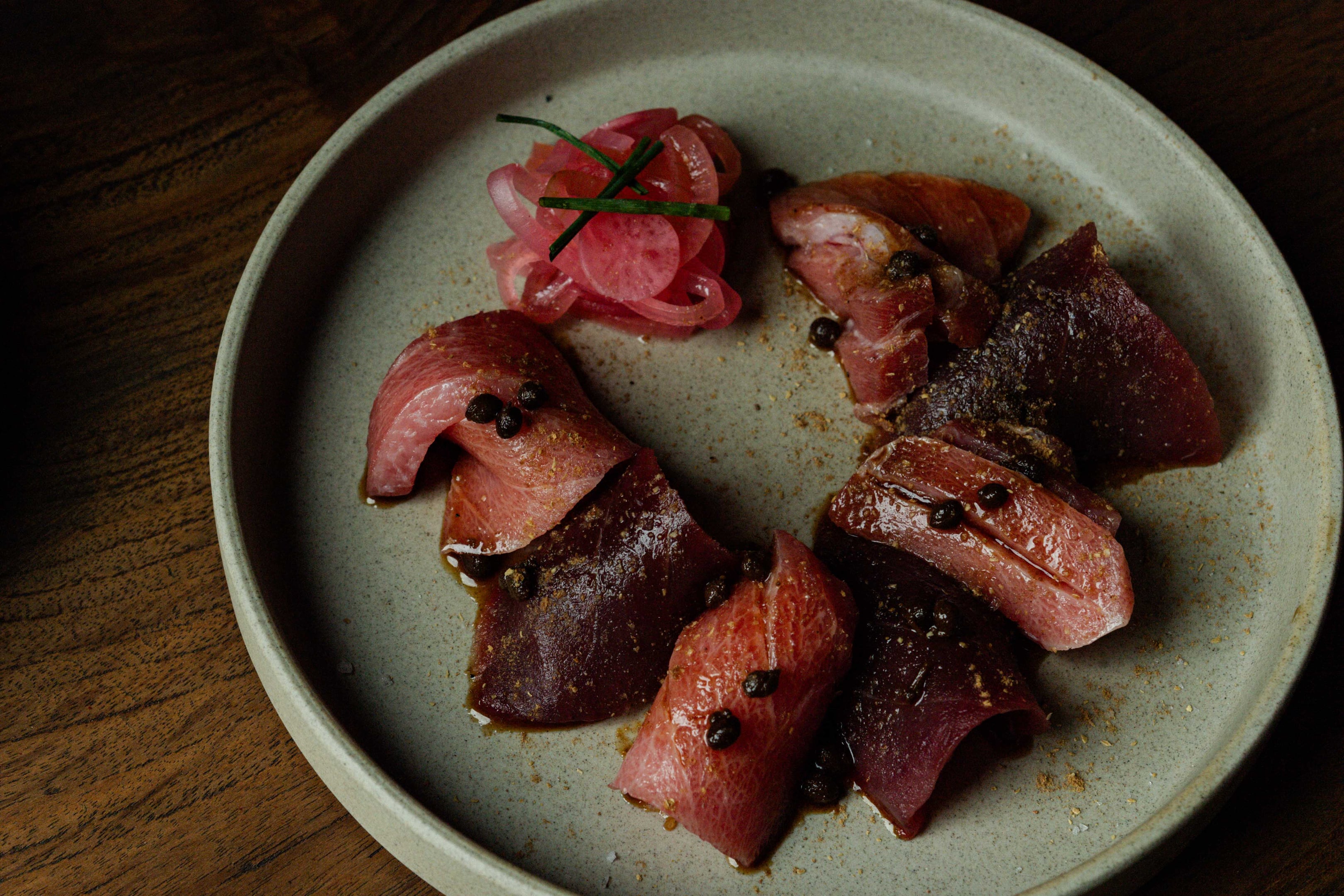 Blue fin tuna sashimi with tosa soy and sansho peppercorns. Photo: Yusuke Oba