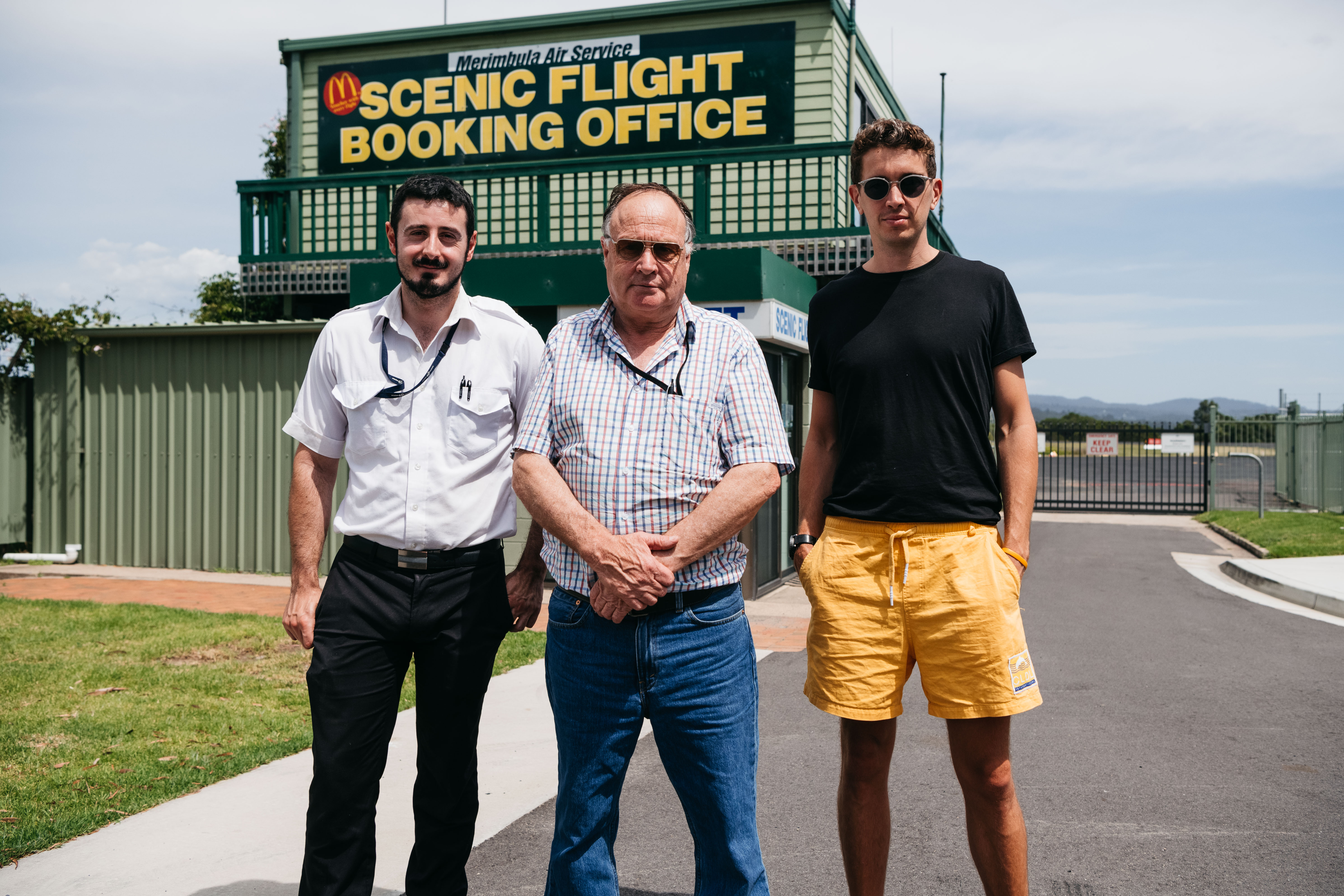 Hugo Gruzman (far right) at Merimbula Airport, where his pilot grandfather Laurie founded air freighting service Flight Facilities.