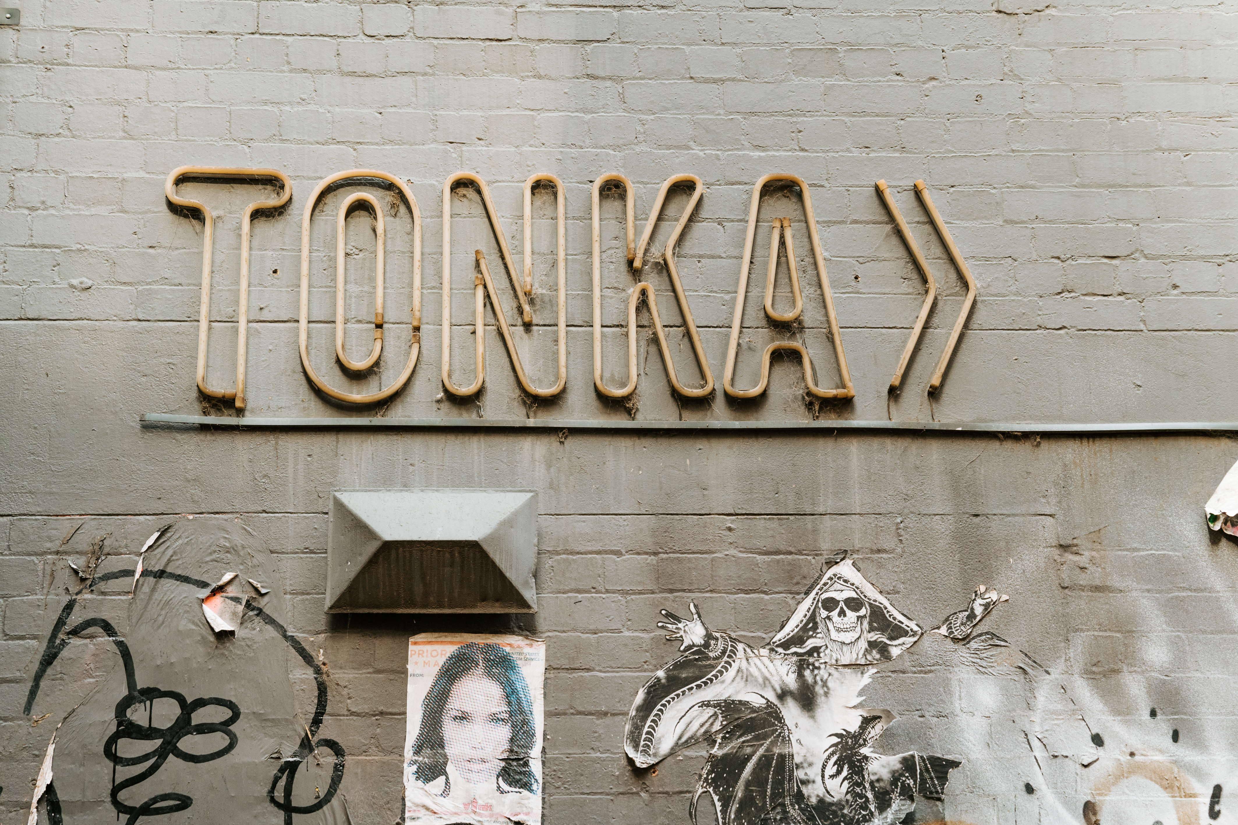 Signage in grungy Duckboard Place | Photography: Arianna Leggiero