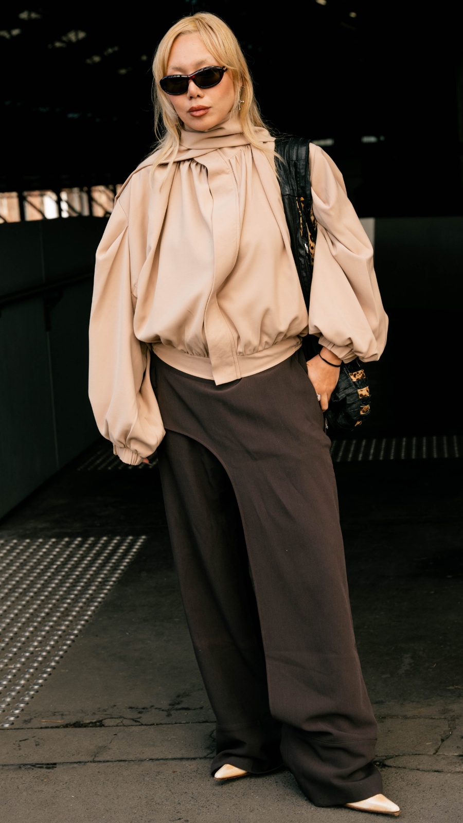 Unexpected details take Karen’s outfit to the next level: asymmetric pants from Vietnamese label The Idiot tie in nicely with her custom-tailored jacket, also from Vietnam. Photo: Liana Hardy