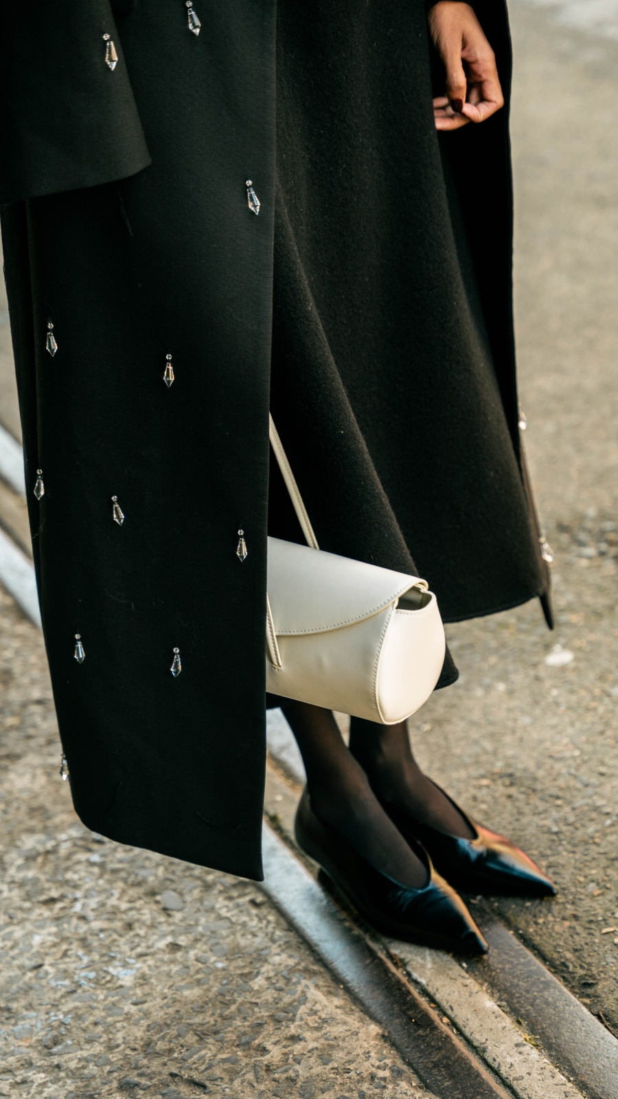 If all else fails, chic prevails. Janitha’s Courtney Zheng coat is effortlessly paired with monochromatic staples. Photo: Liana Hardy