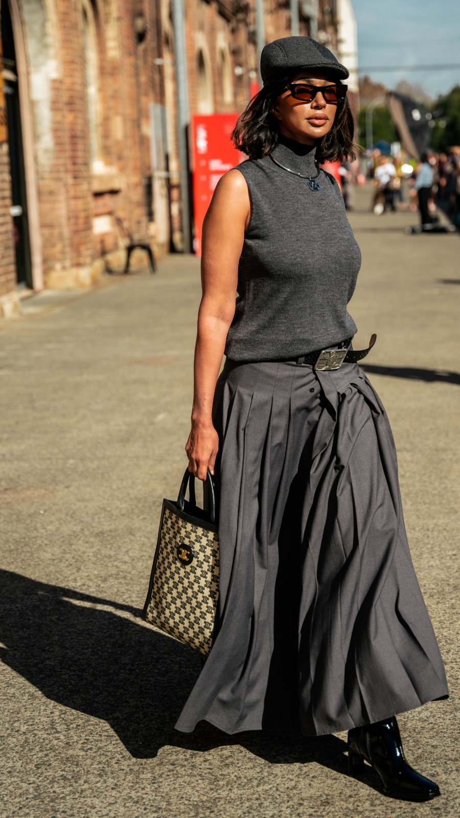 Sharon’s all-grey outfit, topped off with a newsboy cap, is equal parts nostalgic, understated and playful. Photo: Liana Hardy