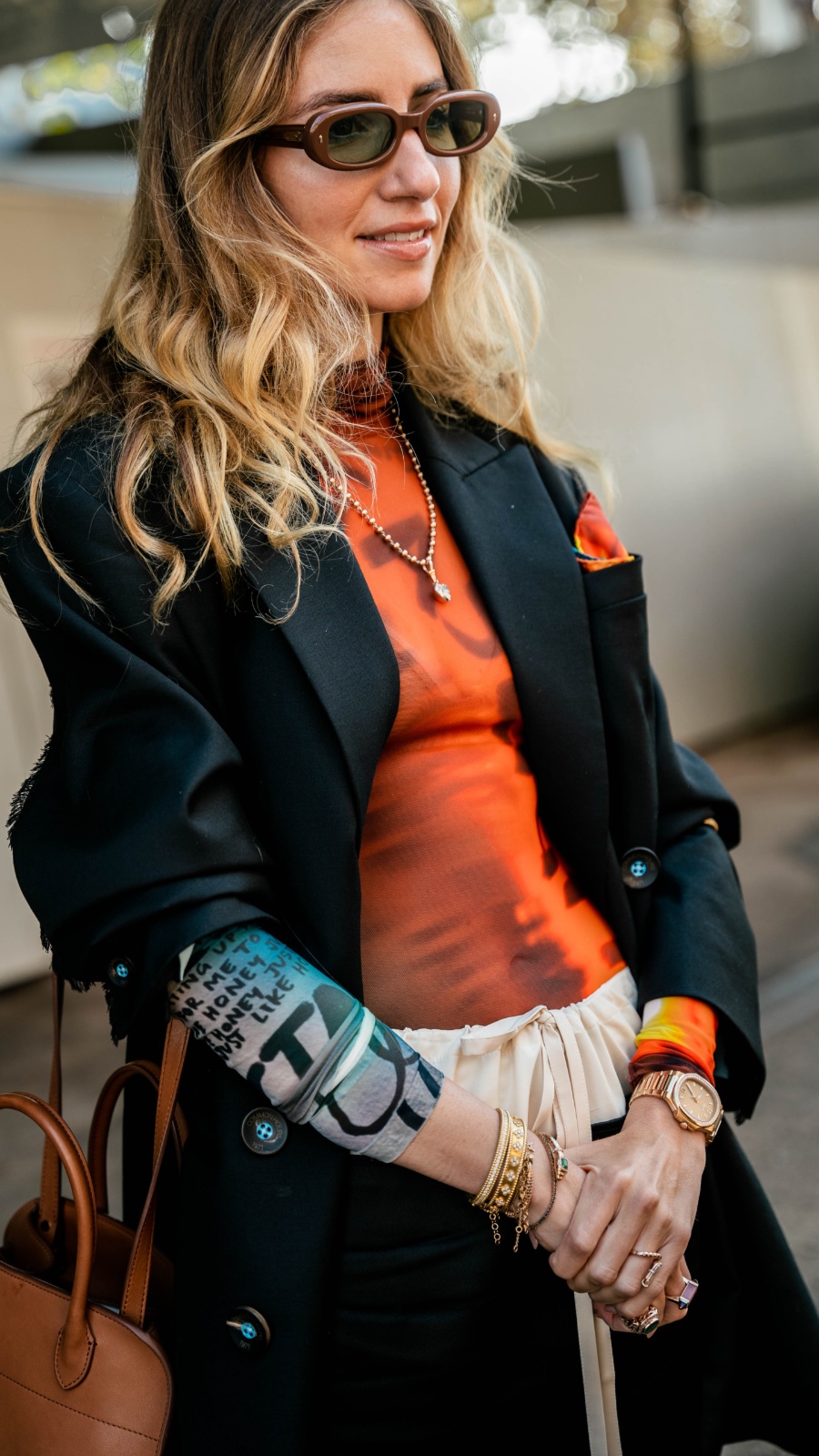 More is more. Dana proves maximalism can be polished, finishing a printed mesh top with a sharp blazer – both from Common Hours. Photo: Liana Hardy