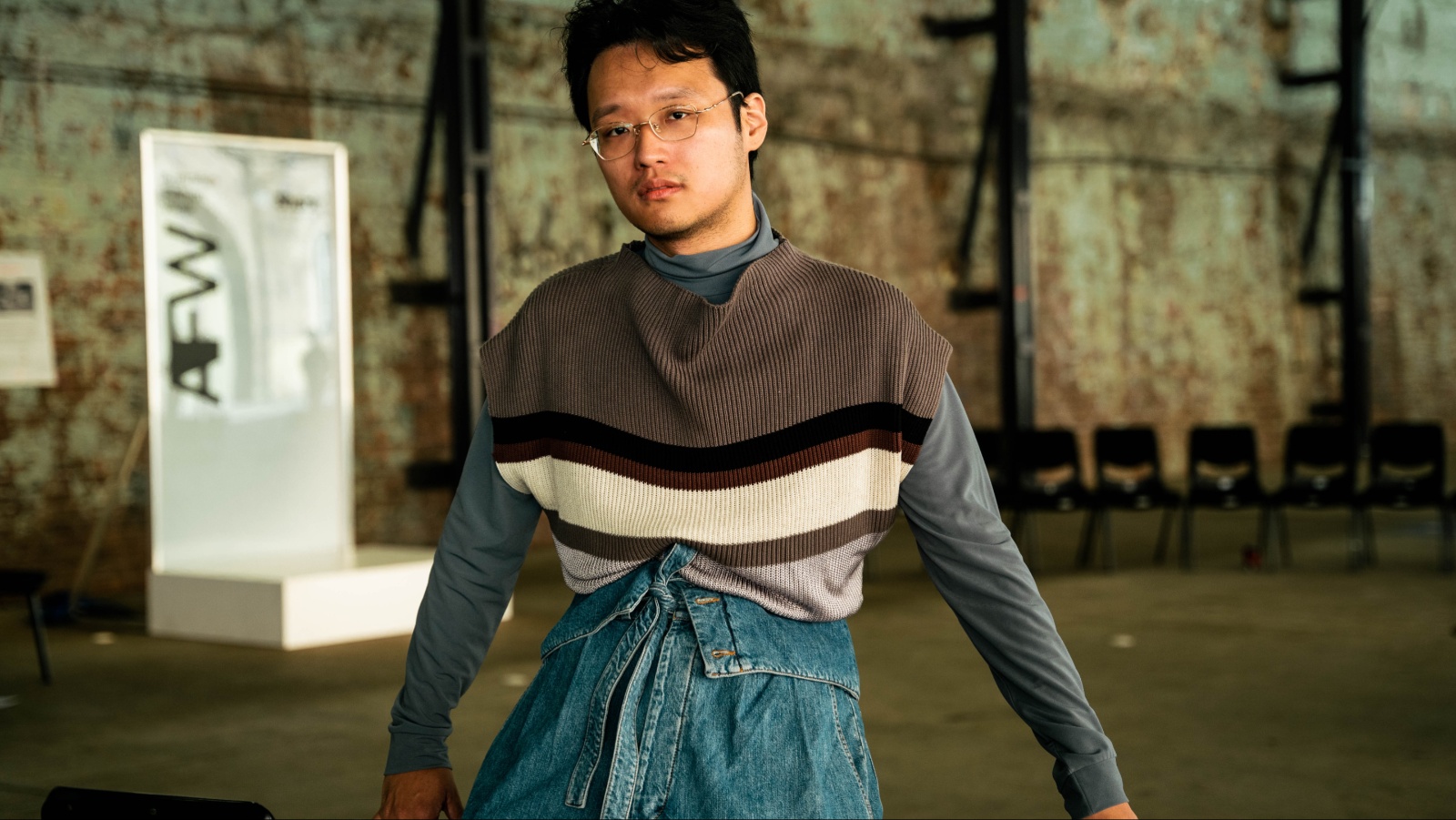 The unexpected waist of these Loewe jeans centres Yuzhen’s layered tops. Photo: Liana Hardy