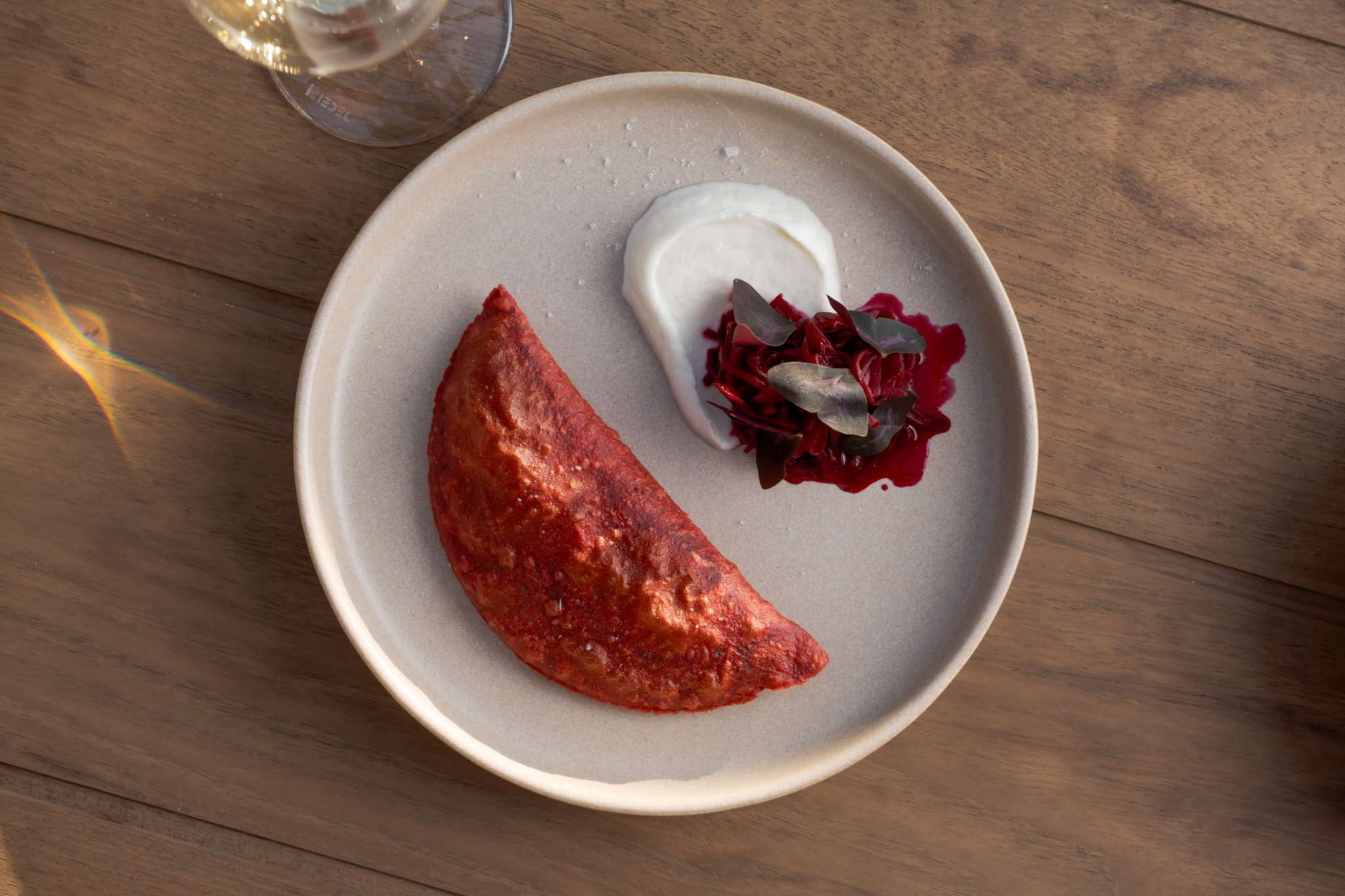 A red beetroot empanada.